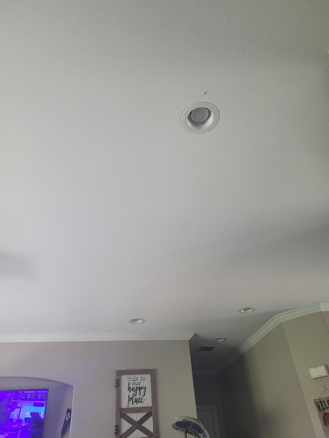 White ceiling with recessed lights.