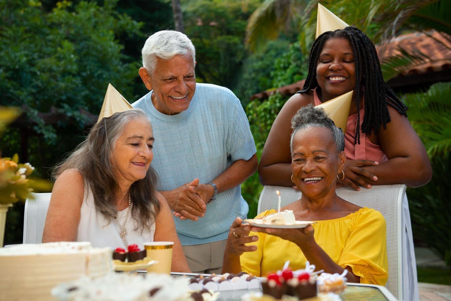 STeel Health Insurance for Medicare A group of elderly people are celebrating a birthday.