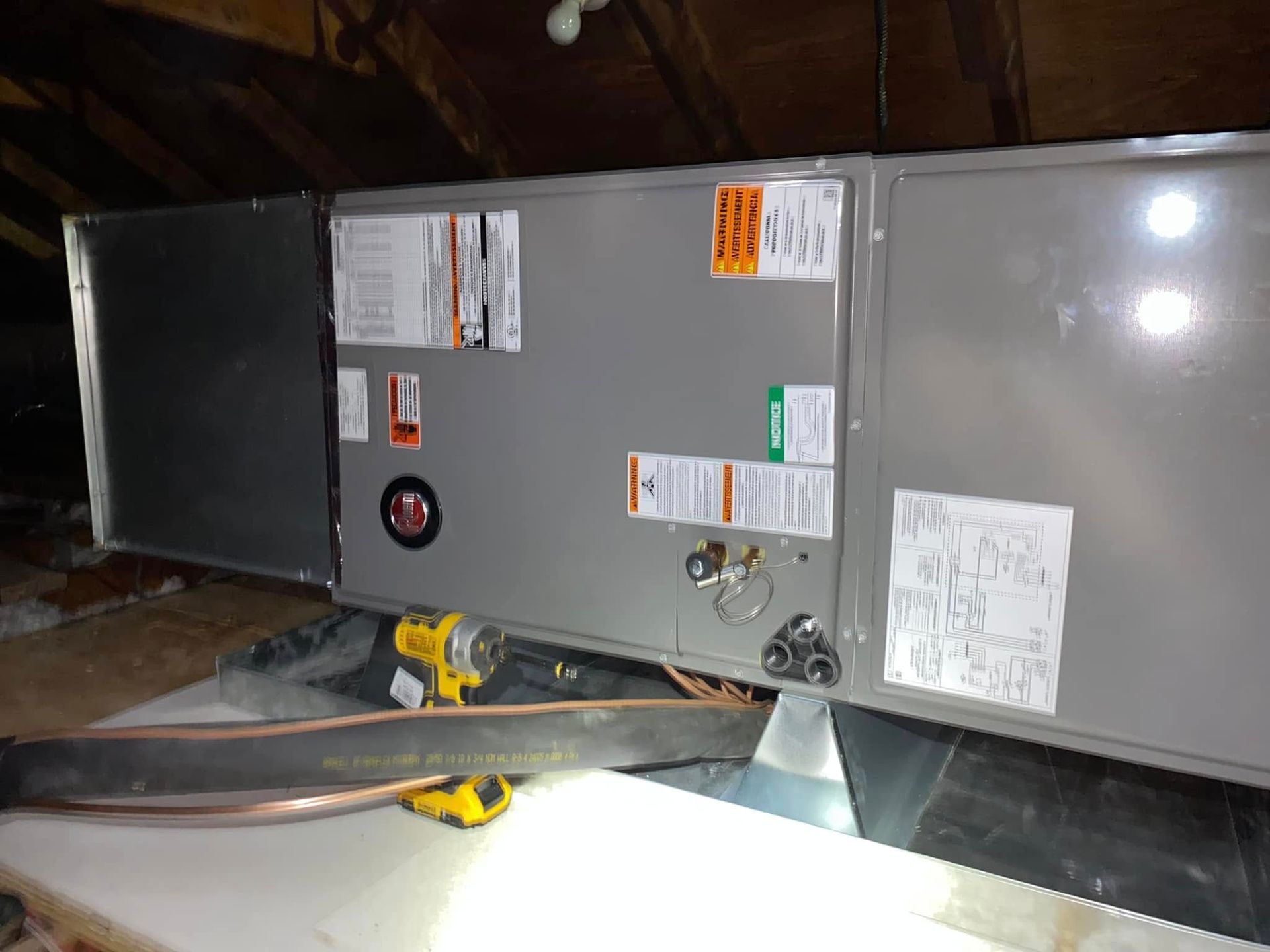 A box with a lot of stickers on it is sitting on top of a table.