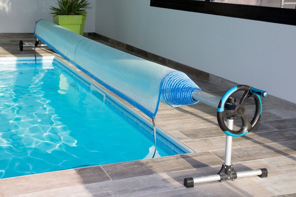 Swimming pool with a cover — Pool Cleaning in Kanimbla, QLD