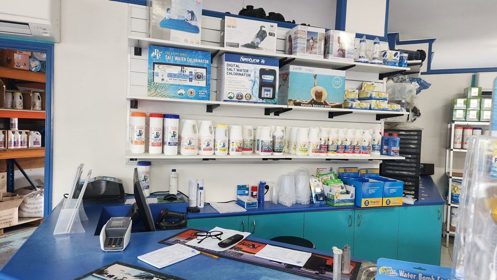 A store filled with lots of products and a counter — Pool Shop in Kewarra Beach QLD