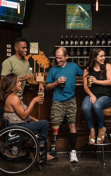 4 people inside a bar having a good time