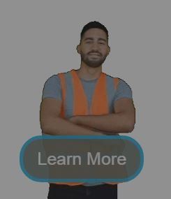 A man with his arms crossed is standing next to a learn more button