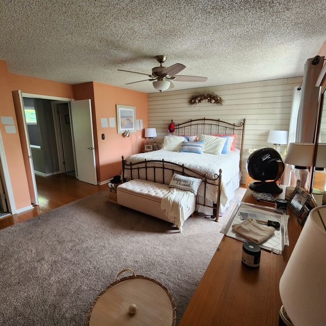 Interior living room refresh with updated wall color, ceiling fan and décor improvements.