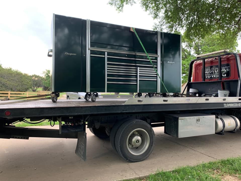 A tow truck with a toolbox on the back of it.