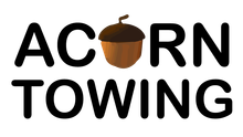 The logo for Acorn Towing with an acorn in the middle.