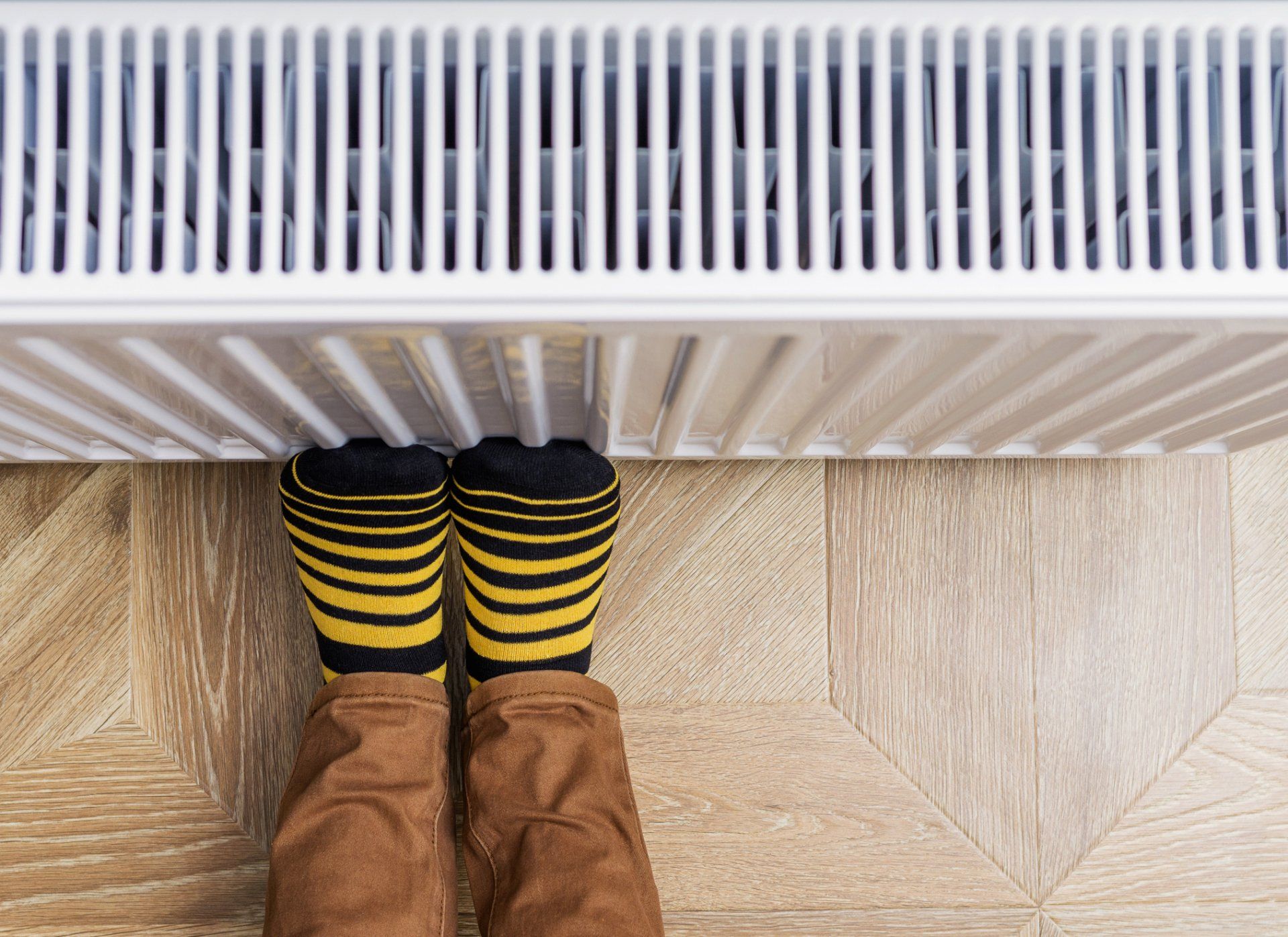 Person Wearing Socks Warming Cold Feet — Winston Salem, NC — Reedys’ Air Conditioning & Heating Service Inc