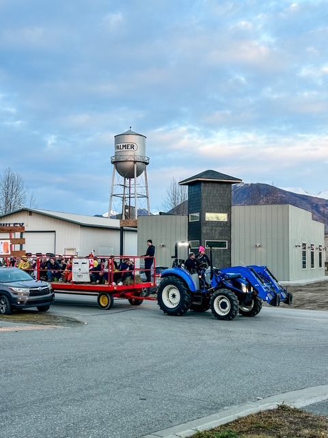Two businessmen discuss marketing projections, with a document in the foreground.