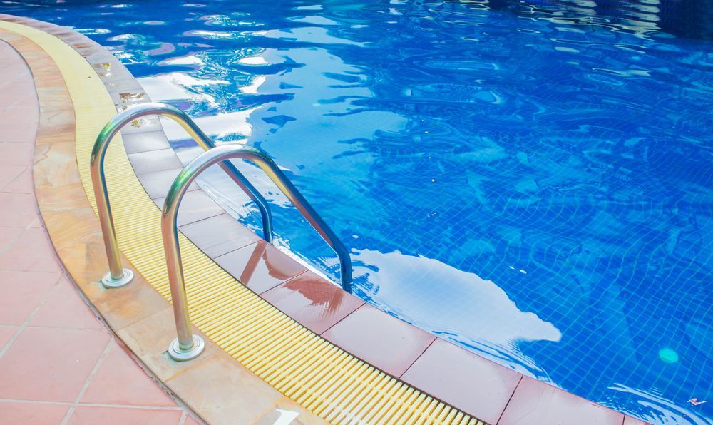 A Close Up Of A Swimming Pool With Stairs Leading Into It — Ballina Pool Shop In Lennox Head, NSW