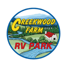 Logo for Creekwood Farm RV Park featuring a winding river, green hills, mountains, a barn, and text in a circular frame.