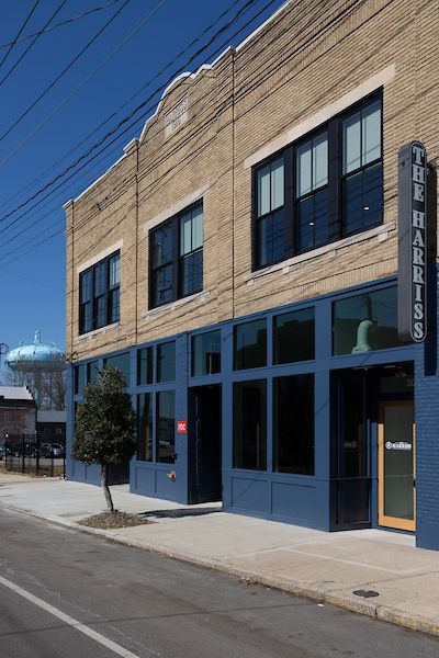 A building with a sign that says the harrison on it