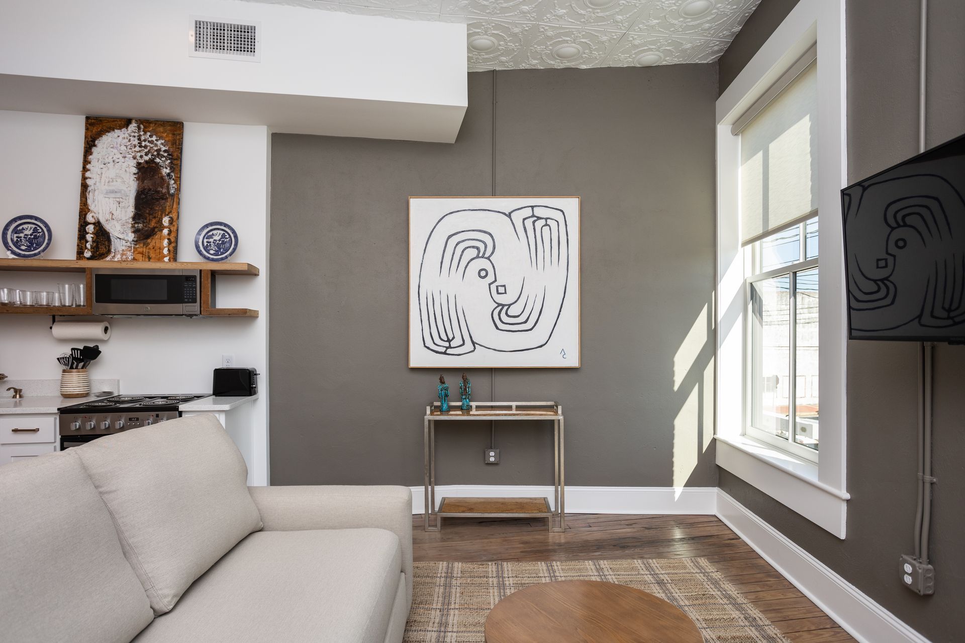 Brown wall with white painting on the wall.