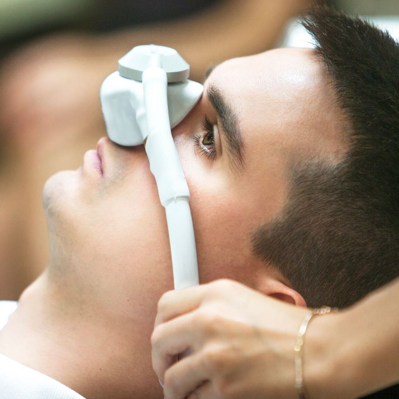 A man with a mask on his face is laying down