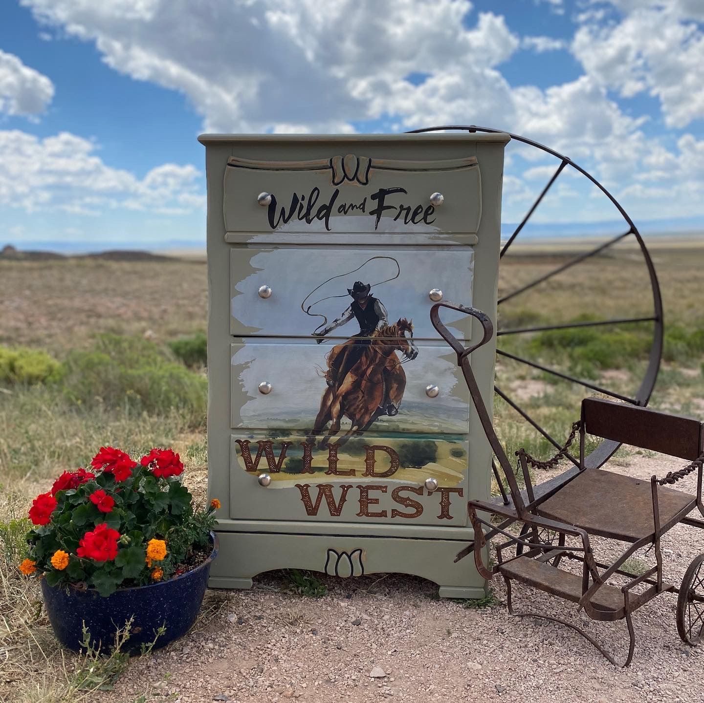 A dresser with a picture of a man riding a horse on it