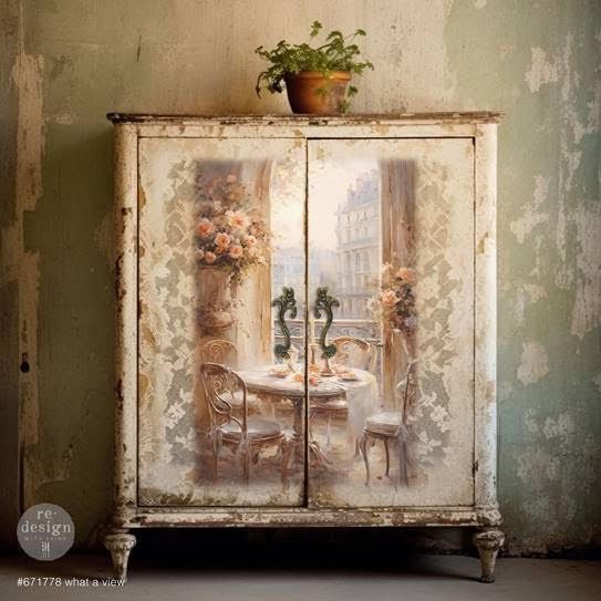 A cabinet with a picture of a table and chairs on it