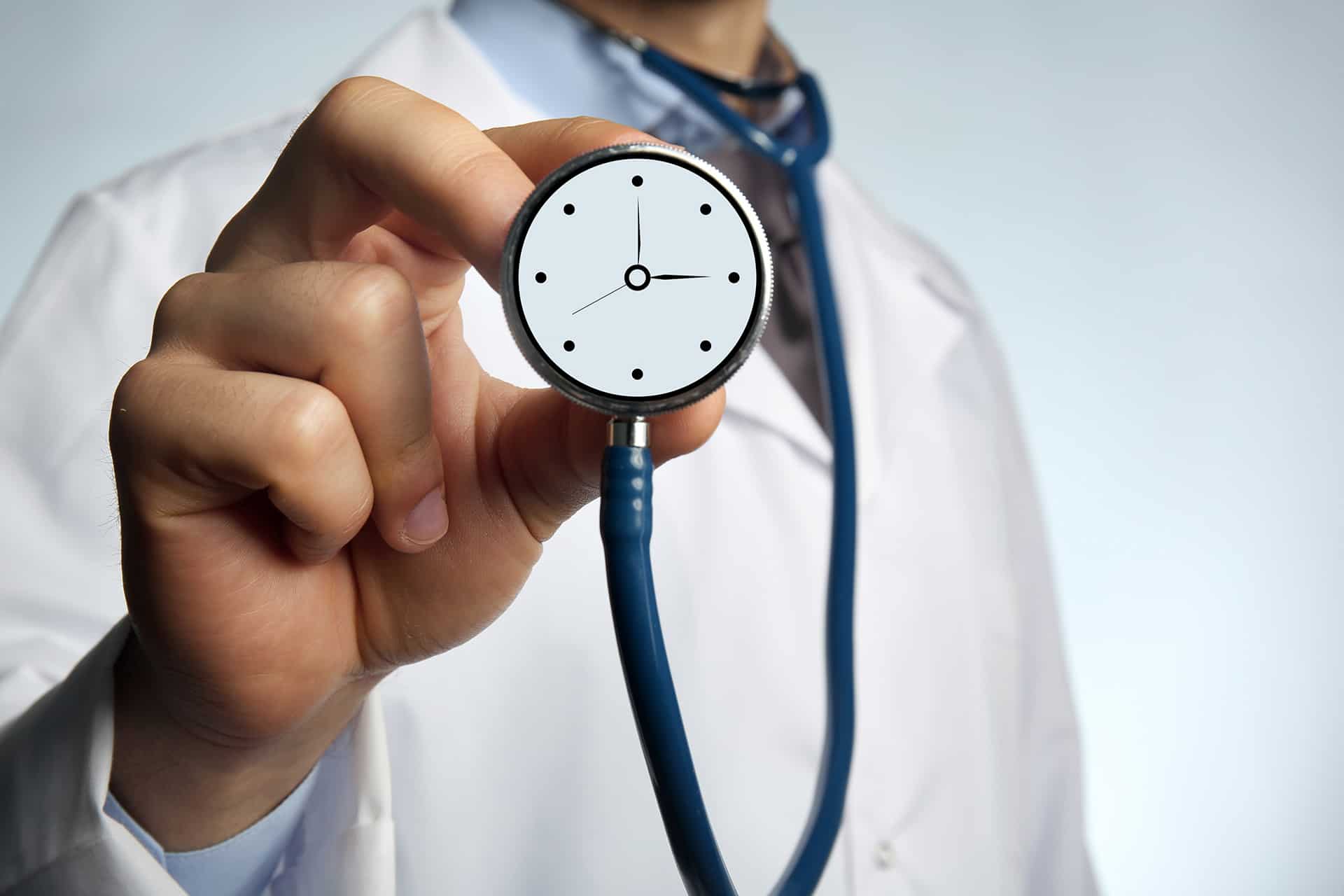 A doctor wears a stethoscope that transforms into a clock near Harrodsburg, Kentucky (KY)