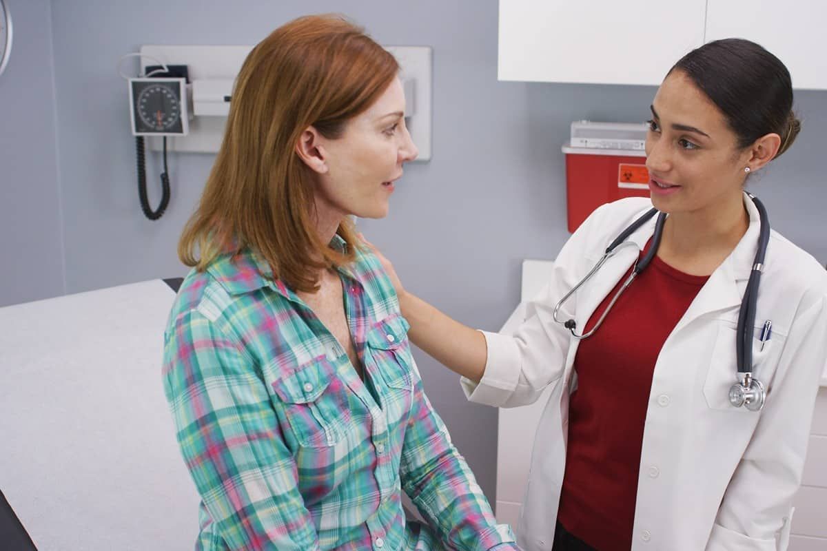 A nurse practitioner consulting with a patient in The Ready Care Clinic in Lawrenceburg, Kentucky (KY)