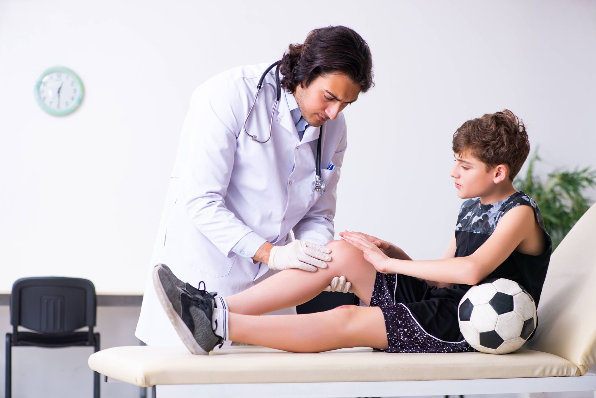 A child receiving a physical from a healthcare provider