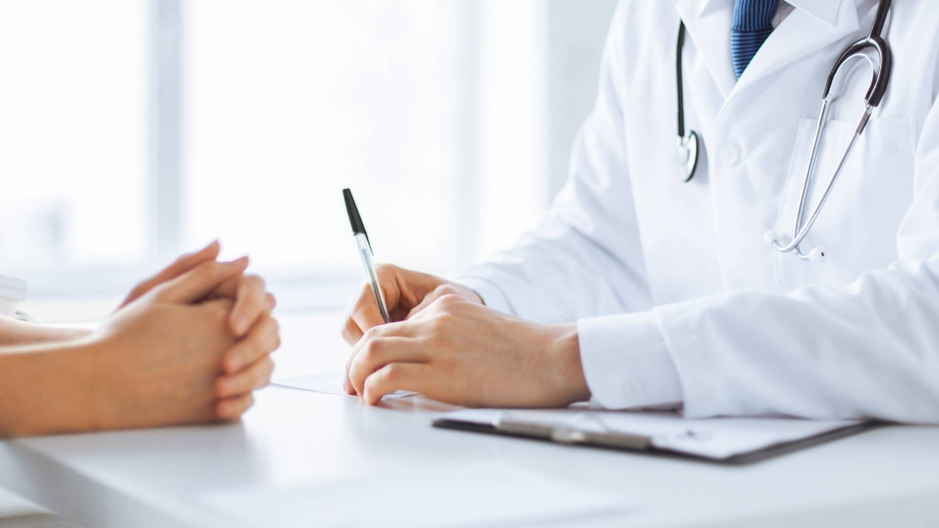 A doctor and a patient discussing medical information at The Ready Care Clinic near Harrodsburg, Ken