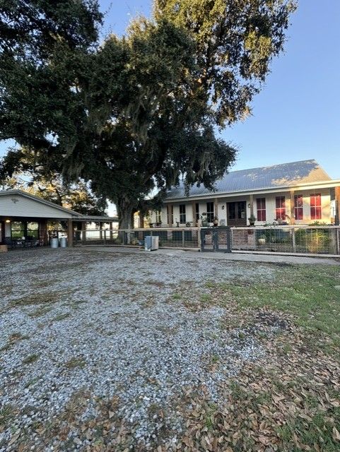 A large house with a large tree in front of it