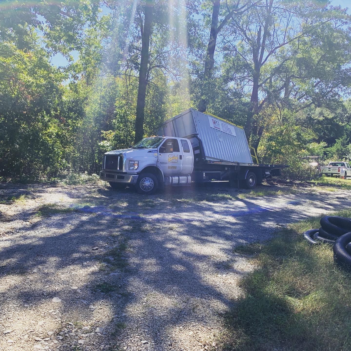 A man in a plaid shirt is using a laptop