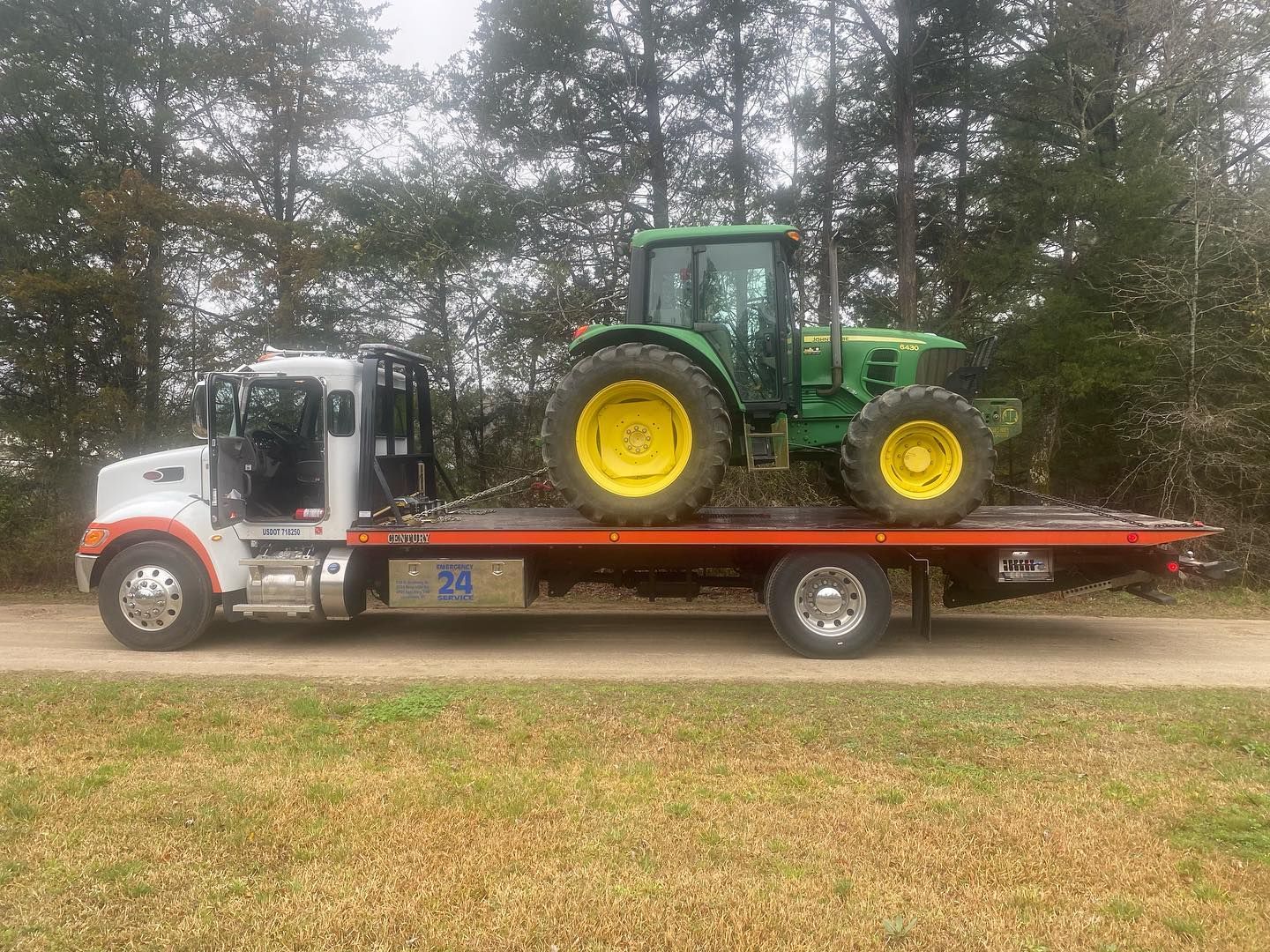 A person in a white apron is working in a kitchen