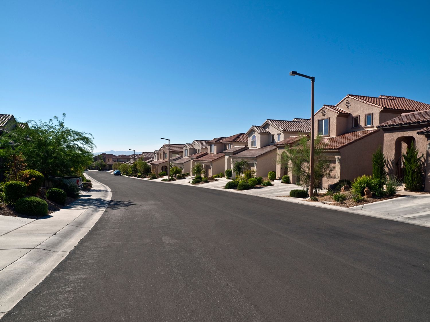 A row of houses on the side of a road