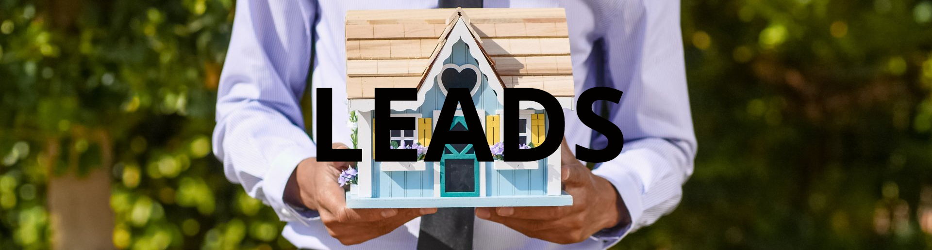 Realtor holding a model house