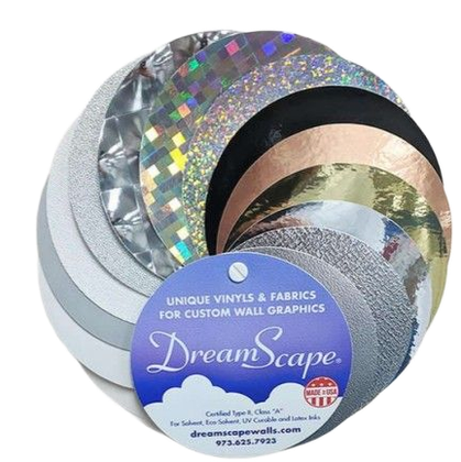Rolls of shiny vinyl and fabric samples in assorted metallic colors, labeled DreamScape