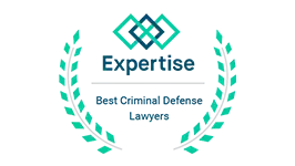 Expertise badge: "Best Criminal Defense Lawyers" text with geometric design and laurel wreath.