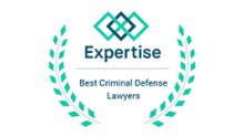 Expertise badge: "Best Criminal Defense Lawyers" text with geometric design and laurel wreath.