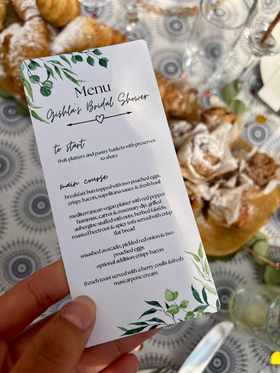 A person is holding a menu for a bridal shower