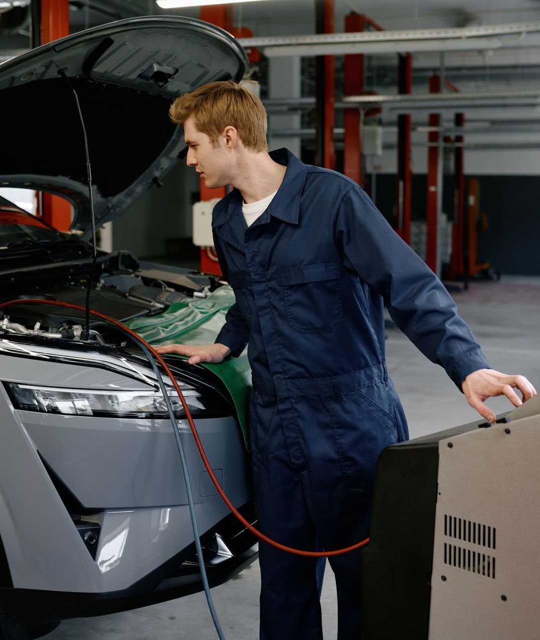 A Mechanic Working on a Car's Air Conditioning System | Chapmans Front End & Brakes