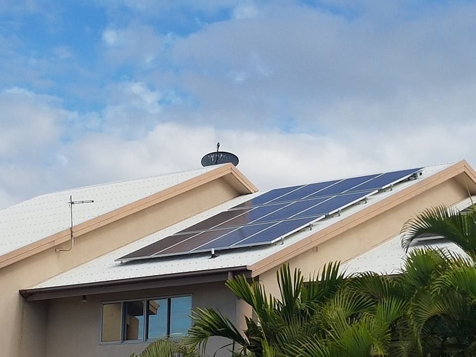 A House with A Lot of Solar Panels on The Roof — Central Solar Services in Garbutt, QLD