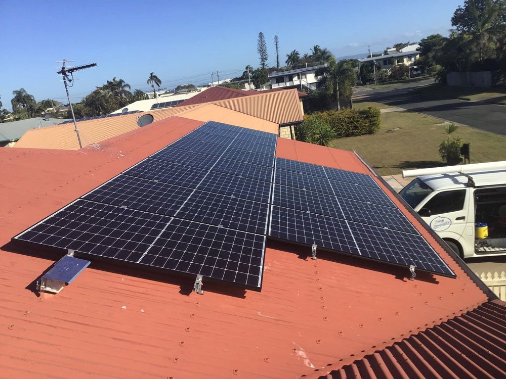 A Solar Panels In Red Roof