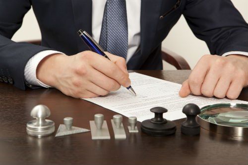Qualified attorney signing legal documents in Jefferson, GA