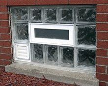 A Window in Between of Glass Block in Bricks — Detroit, MI — Protector Window & Door