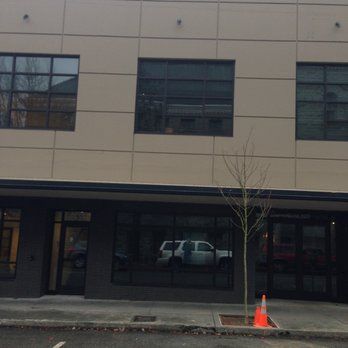 a large building with a car parked in front of it