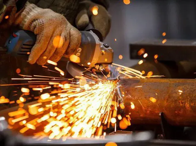 Tim Ledford Towing and Auto Repair Service image of auto repair technician grinding metal