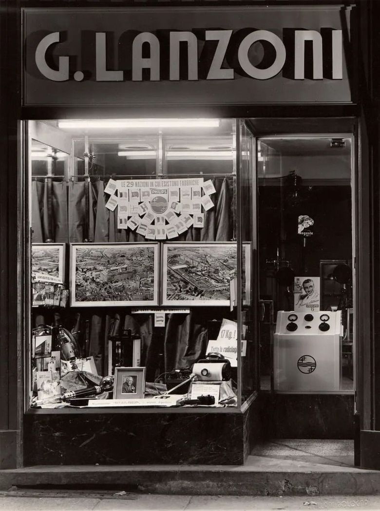 A black and white photo of a store called g. lanzoni