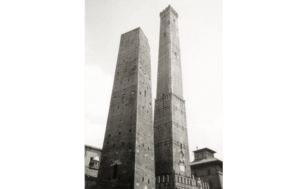 A black and white photo of two very tall buildings