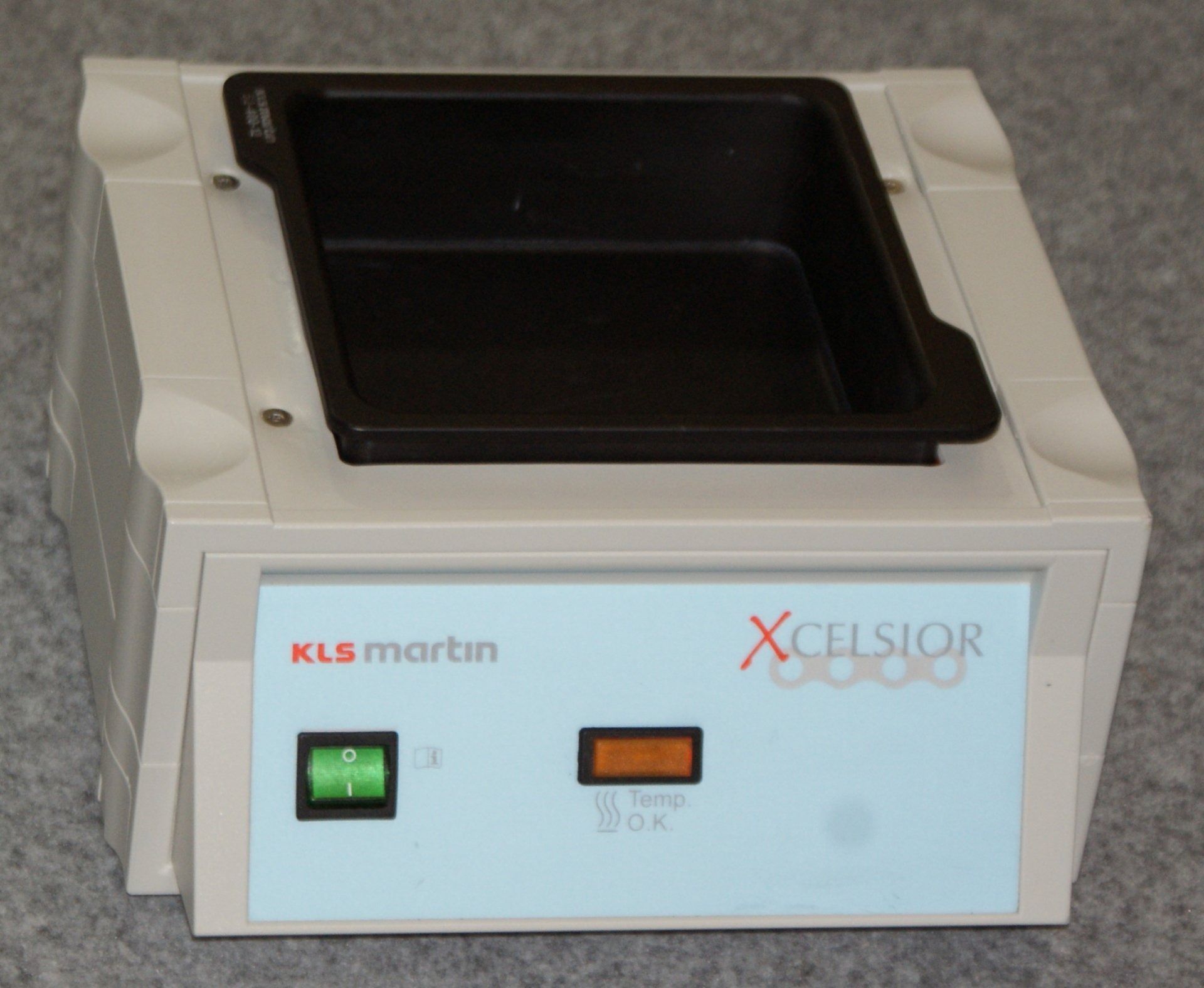 A kls martin xcelsior machine with a black tray
