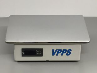 A vpps scale is sitting on top of a table.