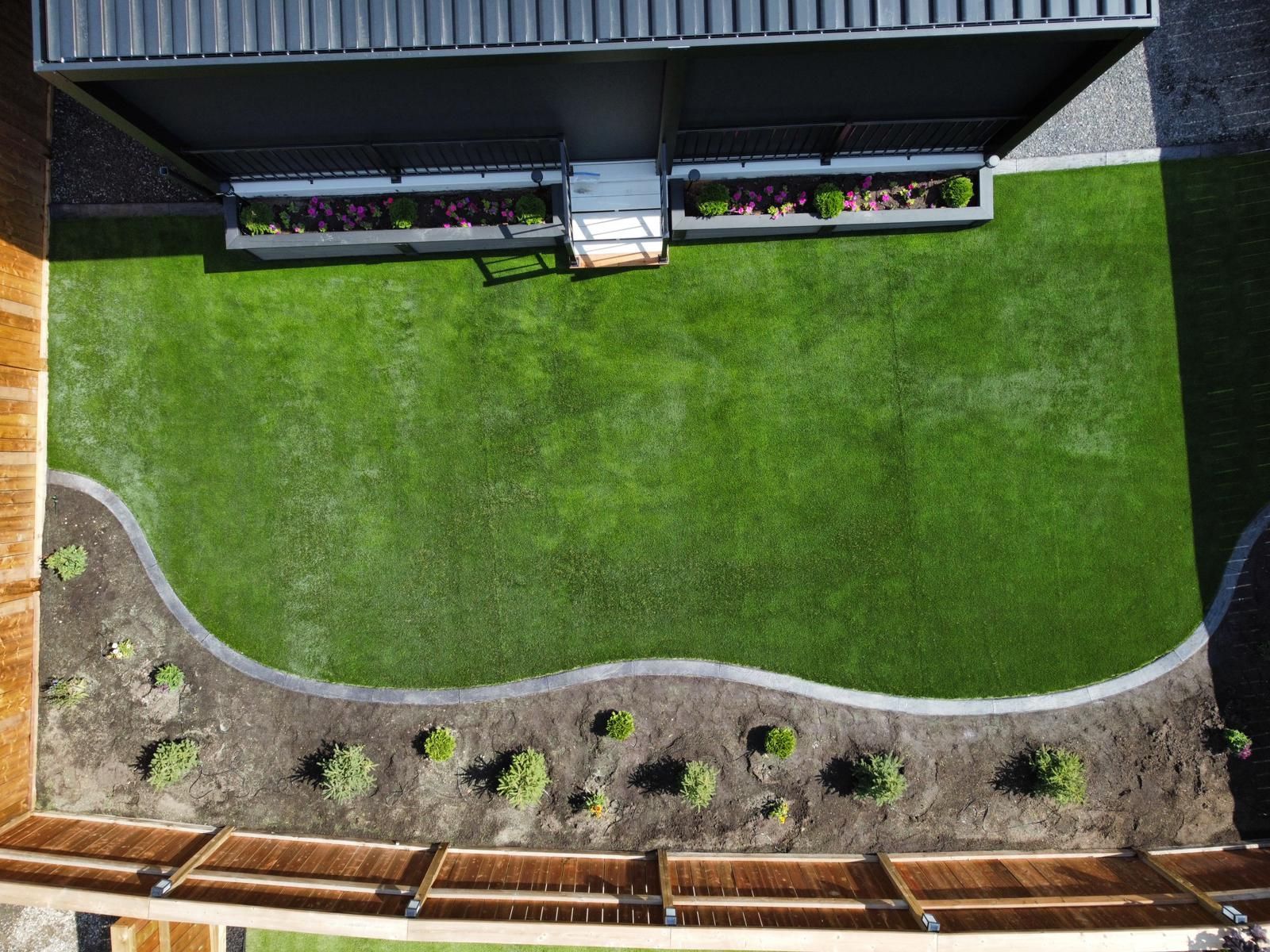 synthetic grass and garden bed overview