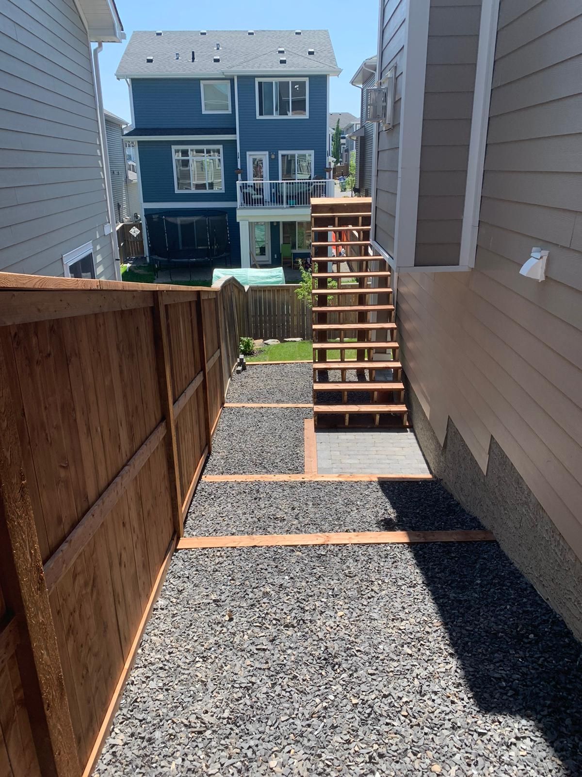 stairs beside house to gravel