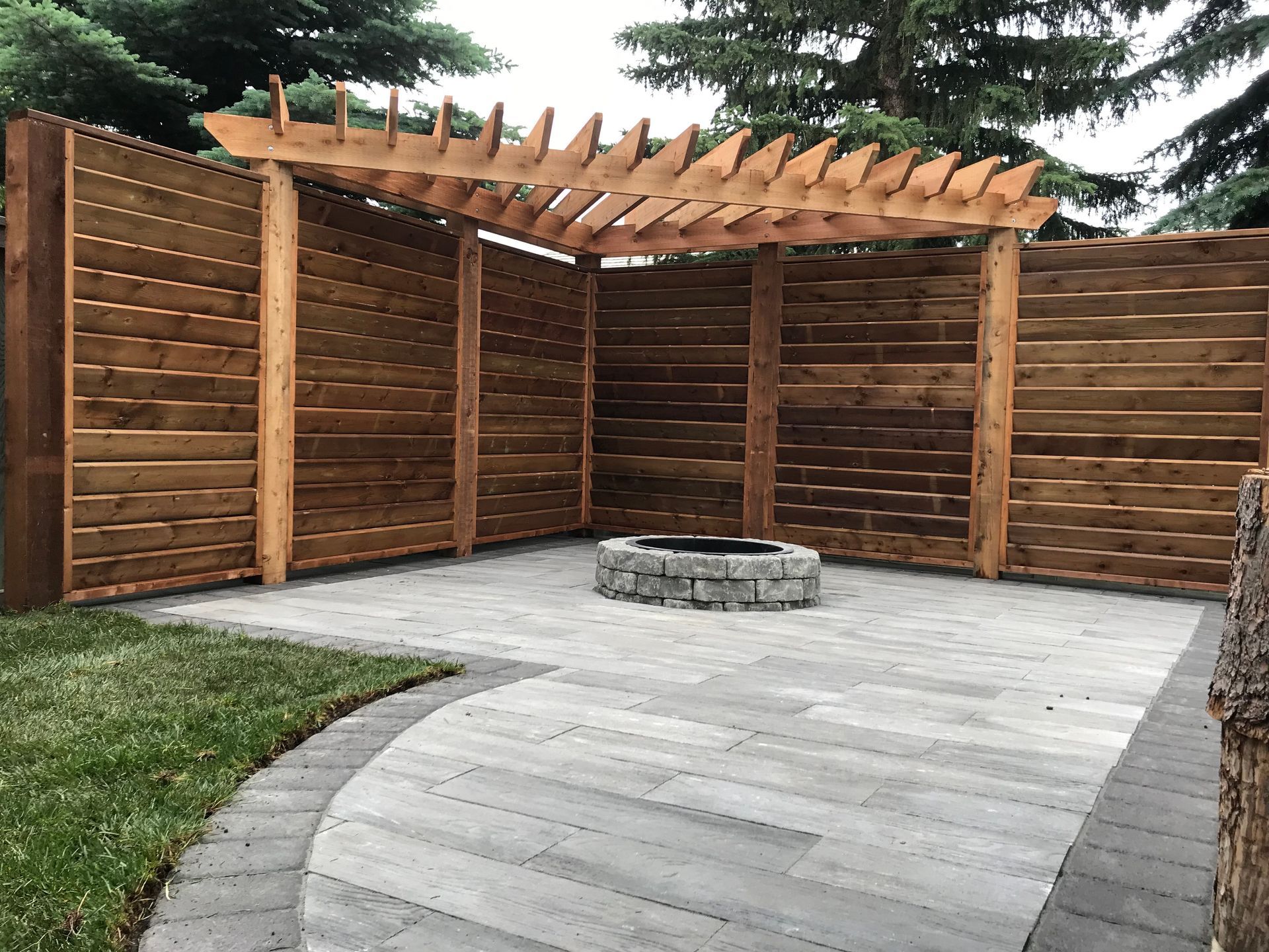 two tone stone patio with fire pit