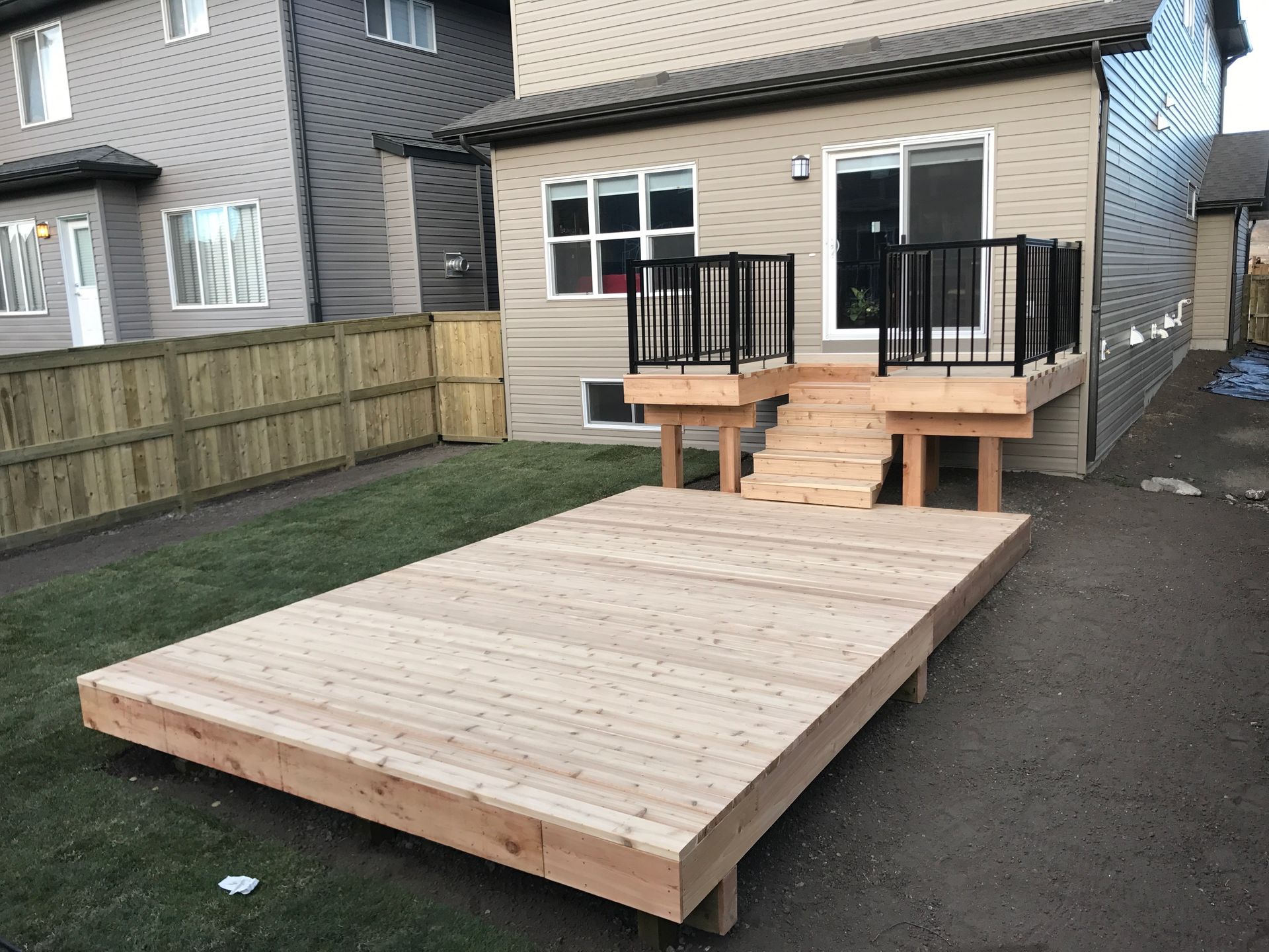 raised wood deck down to lower wood deck