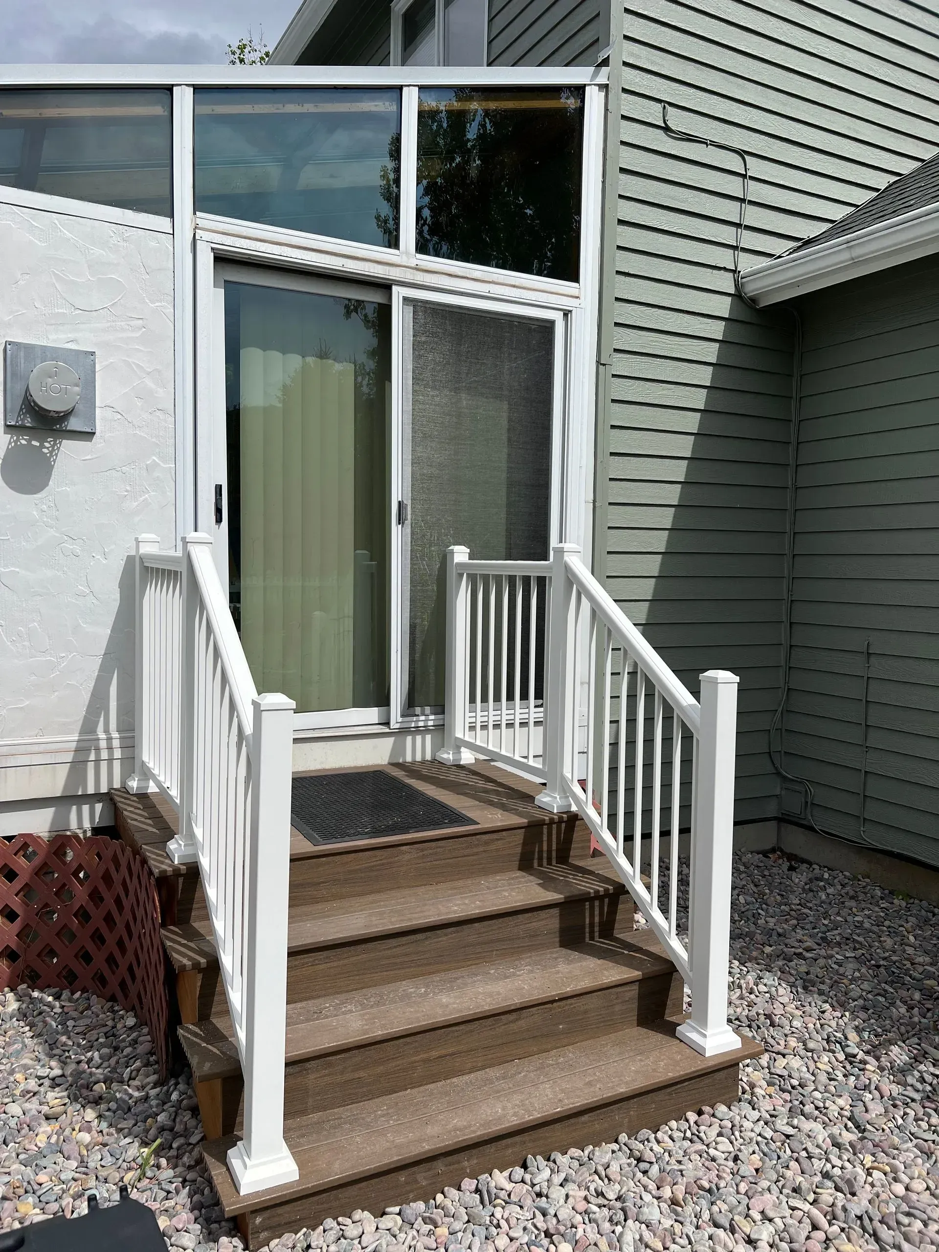White crown molding at the corner of a green wall and white ceiling.