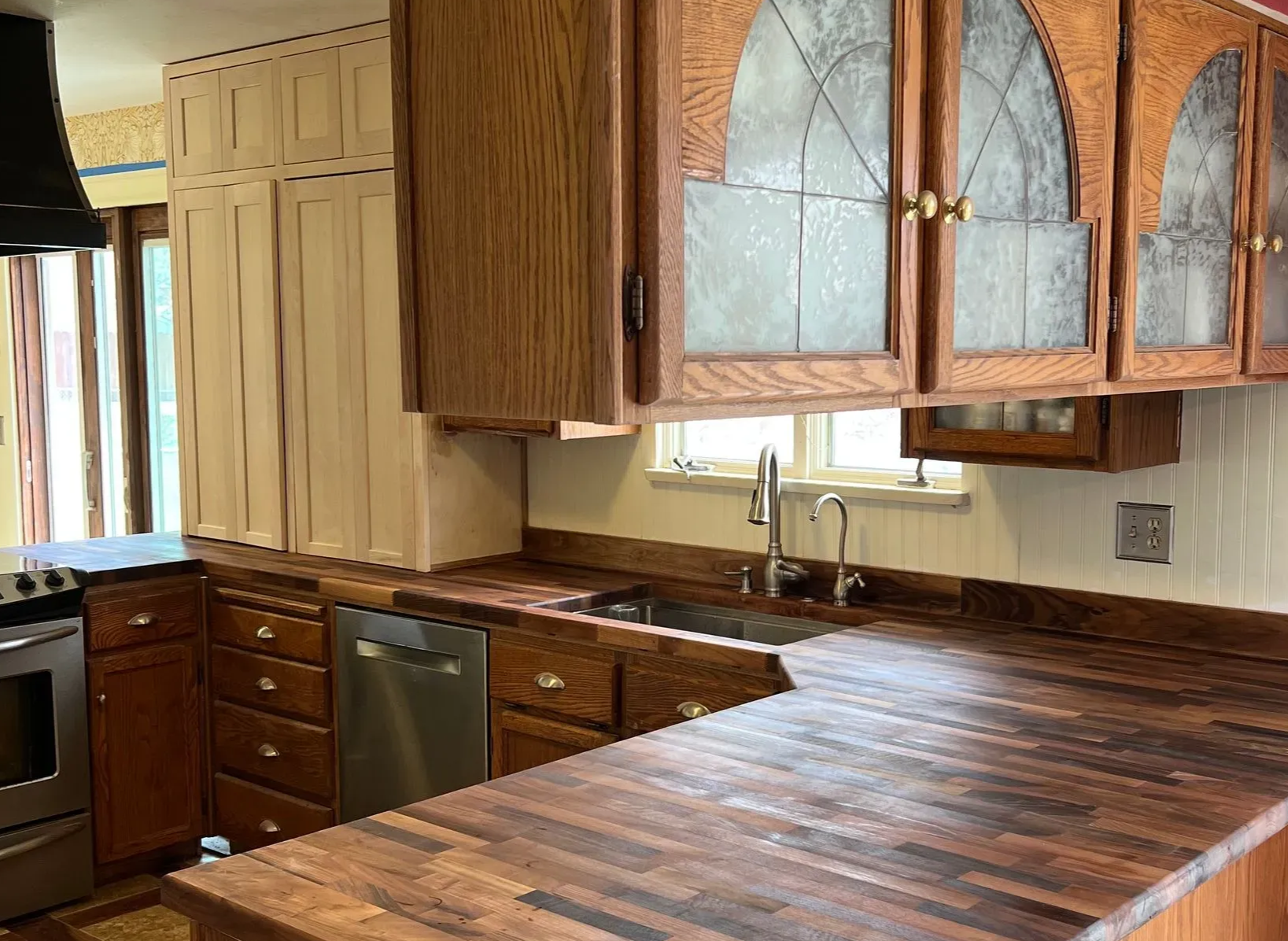 Barn door and white textured wall in an office. Light grey door, horizontal wall texture.