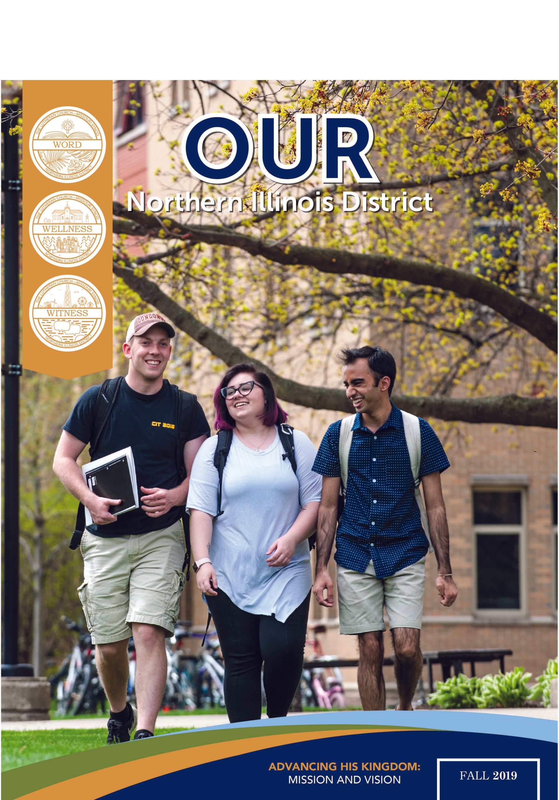 A group of people are walking down a sidewalk.